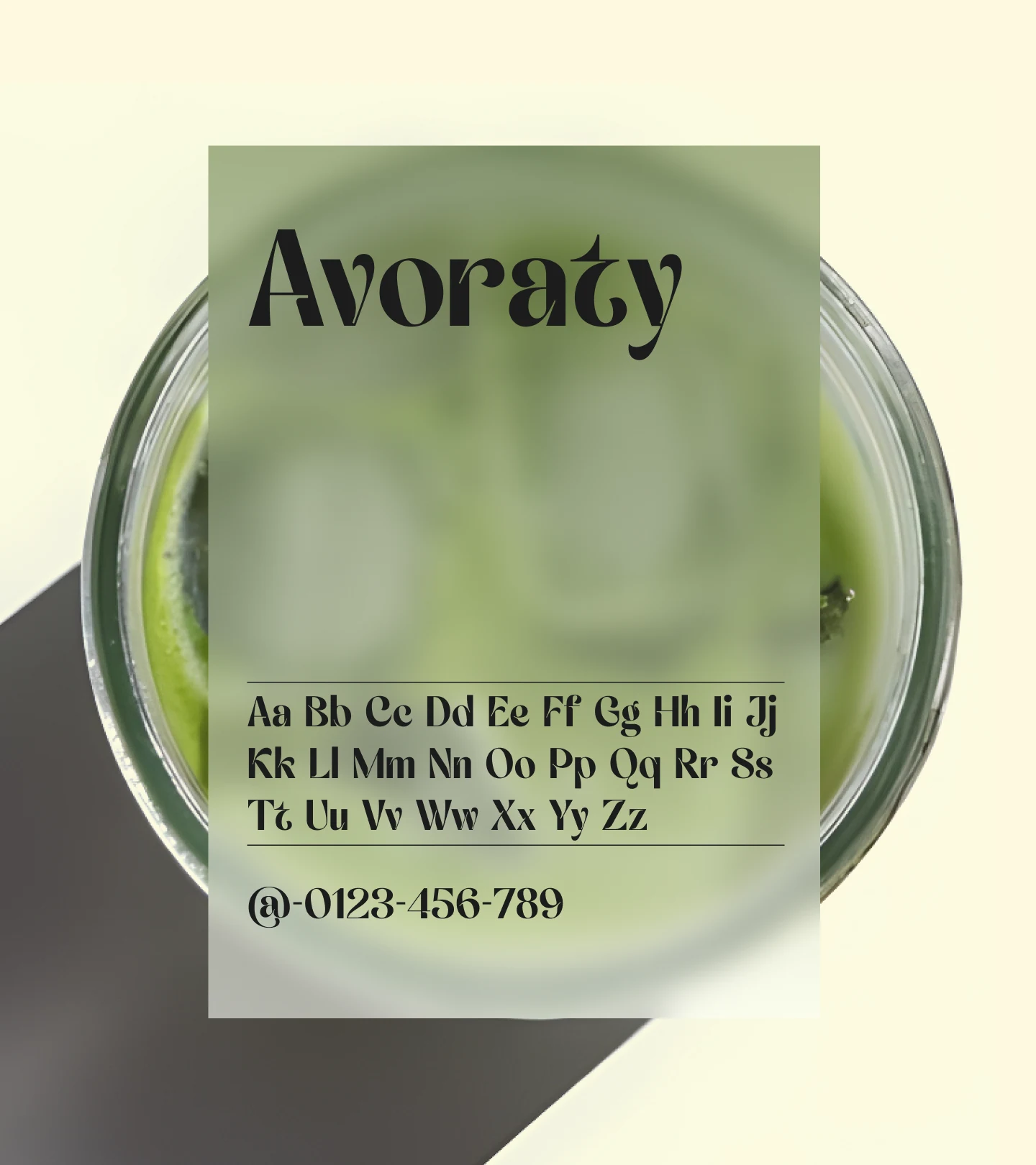 Avoraty type specimen card: the name set large in the display serif above the full upper and lower case alphabet and figures, floating over a glass of iced matcha