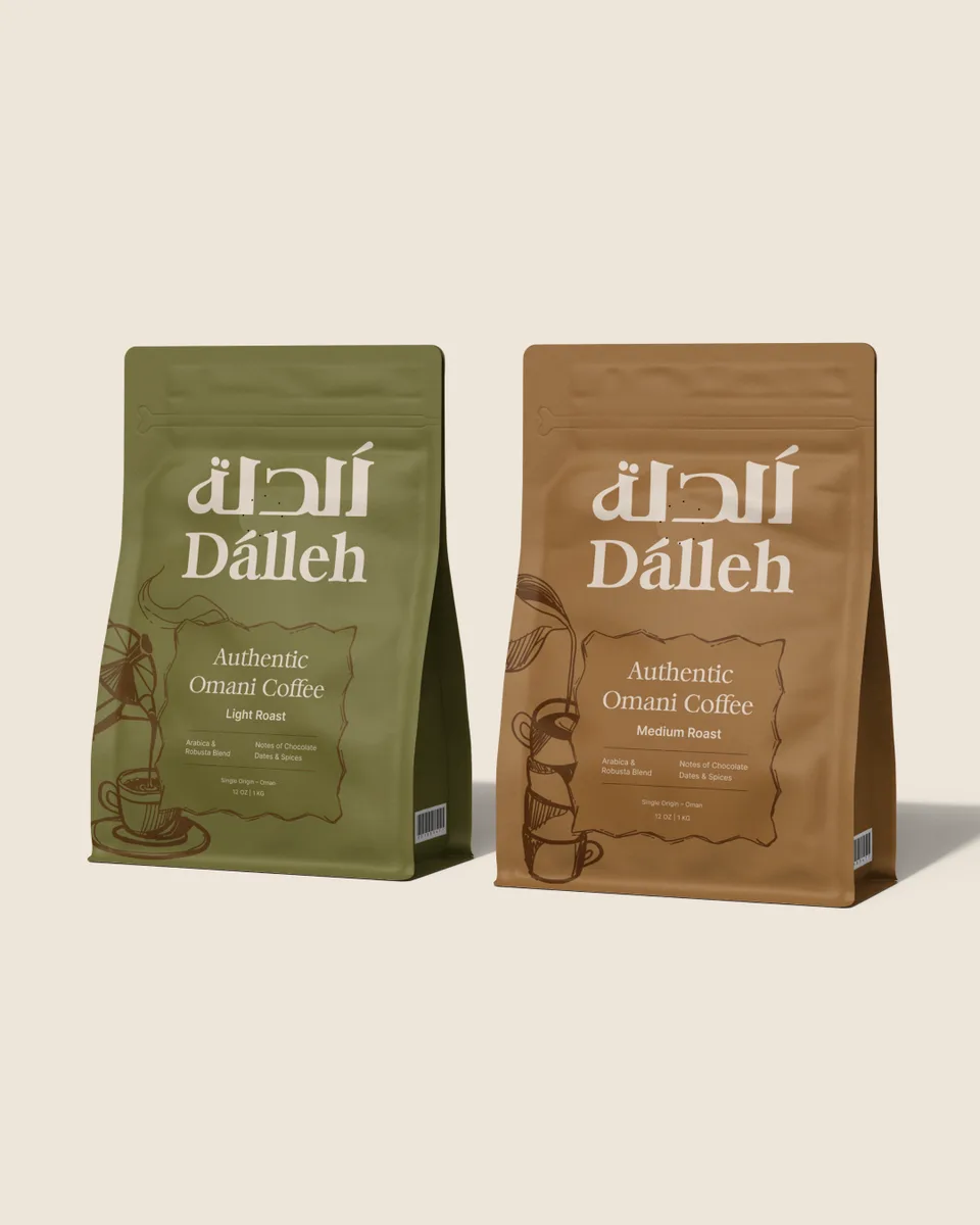 Olive Light Roast and caramel Medium Roast Dalleh coffee bags side by side on a linen cream ground