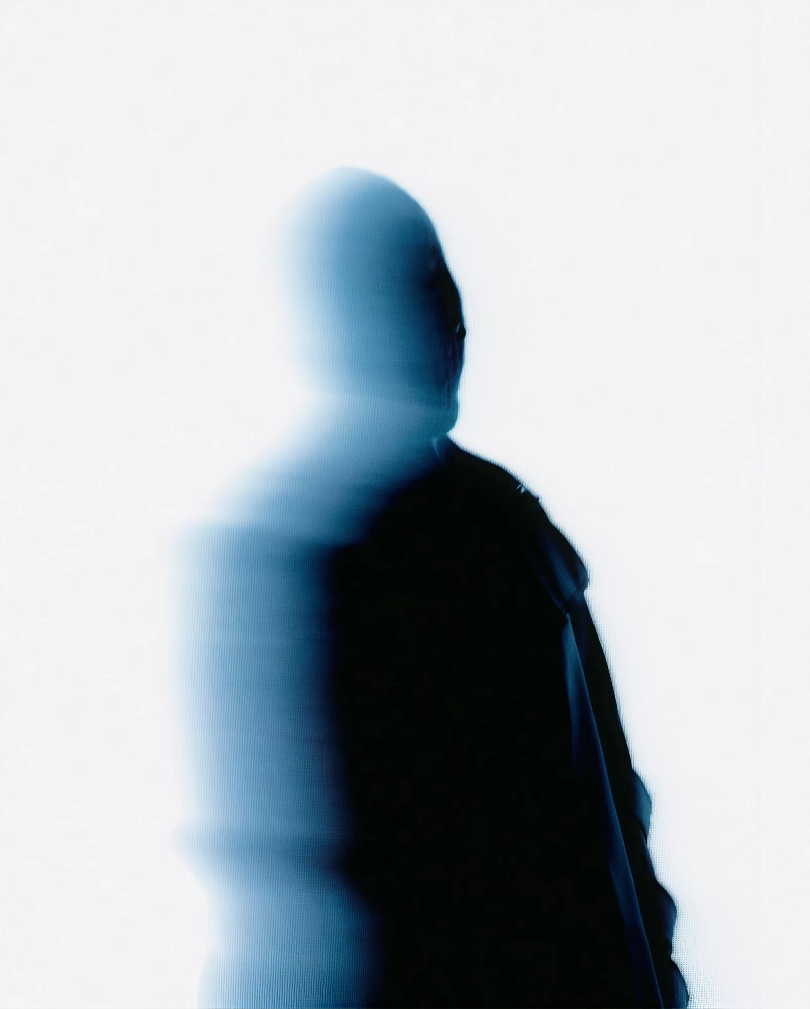 Indigo art direction: a motion blurred figure in deep blue against white