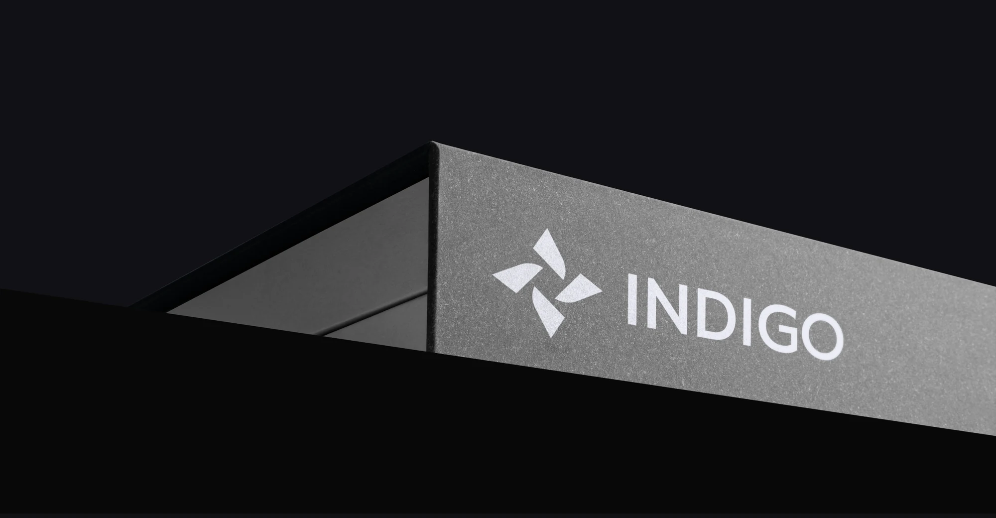 Indigo environmental signage: the lockup on an angled metal canopy