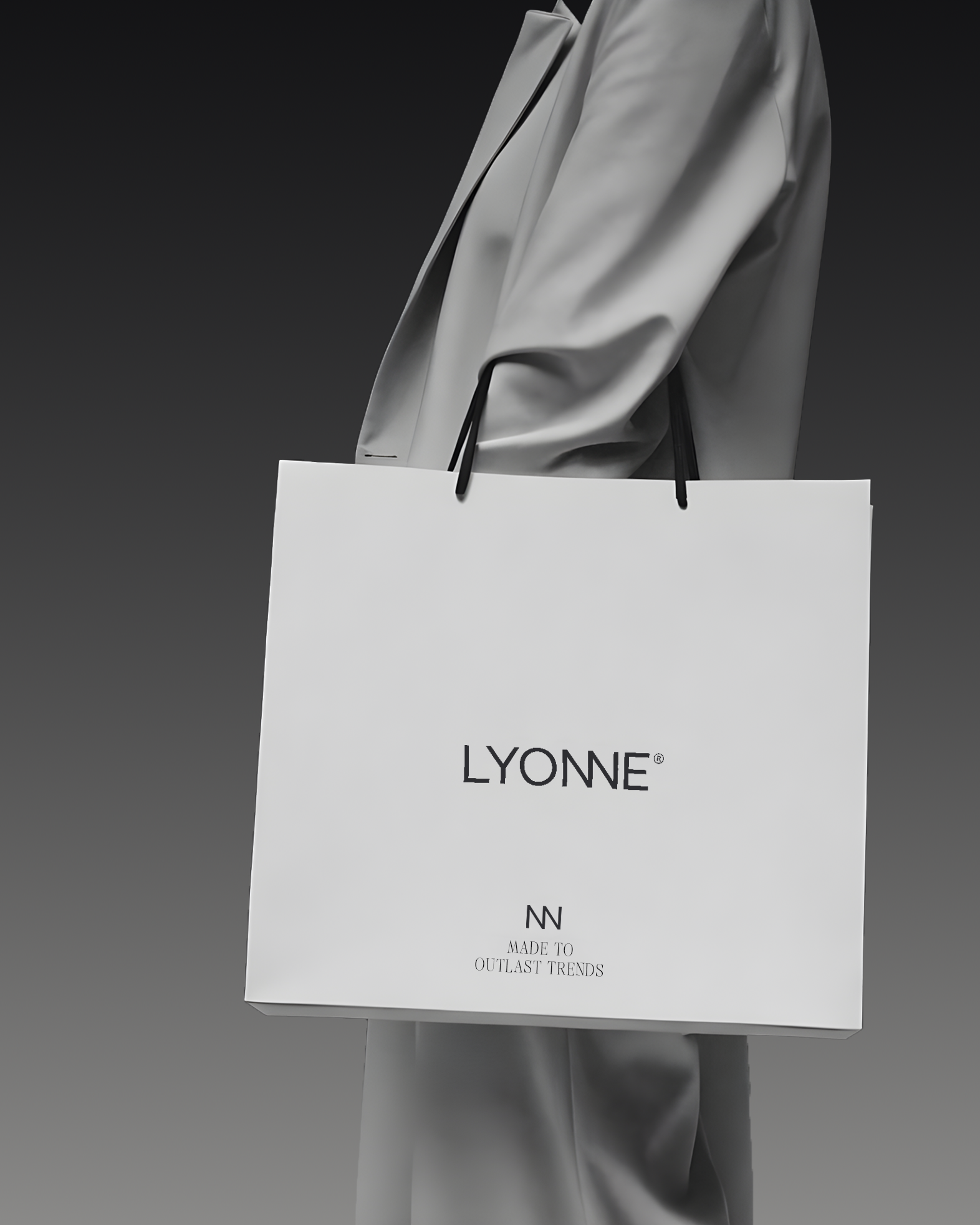 White Lyonne shopping bag with the monogram and Made To Outlast Trends tagline, carried against a grey suit