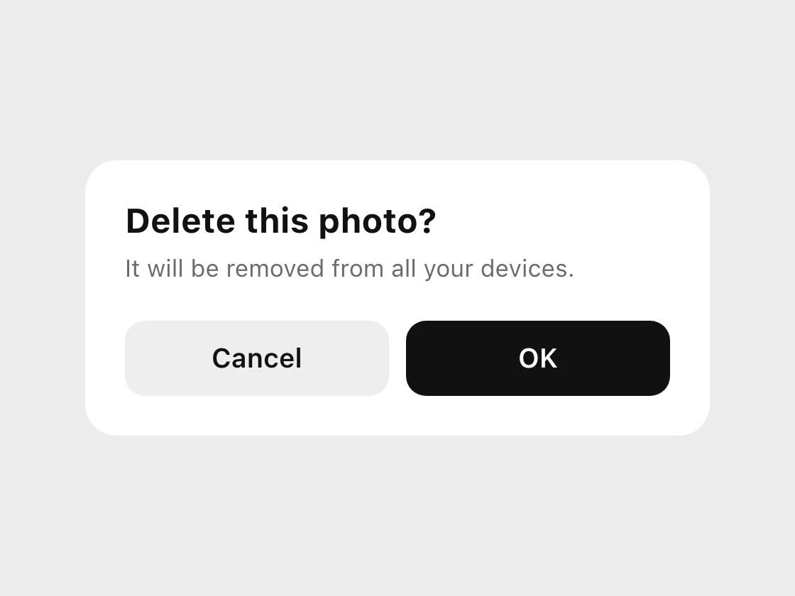 A dialog titled Delete this photo with two buttons, Cancel and a black OK